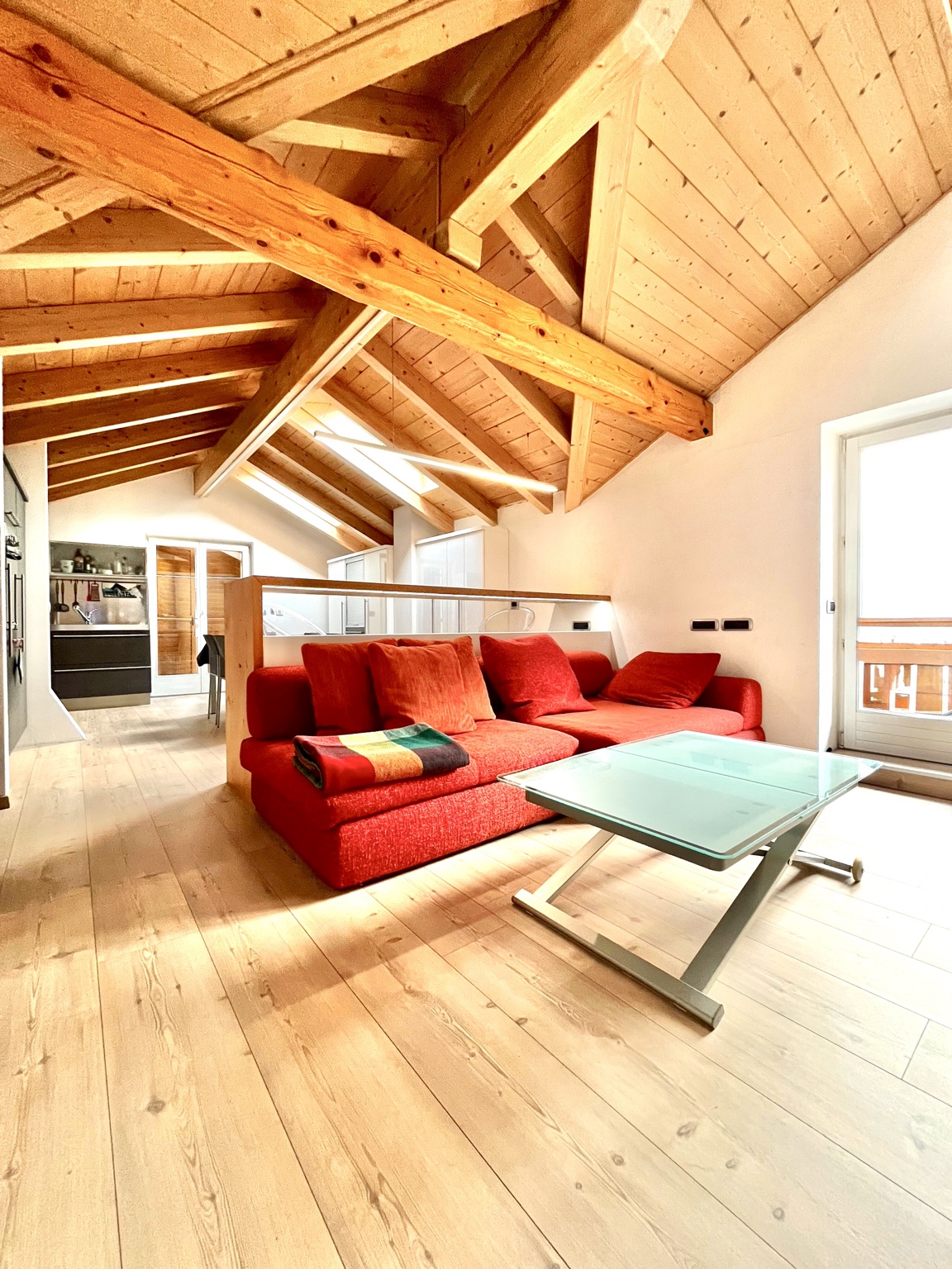 LOR/Y Home open-plan living area with exposed timber roof