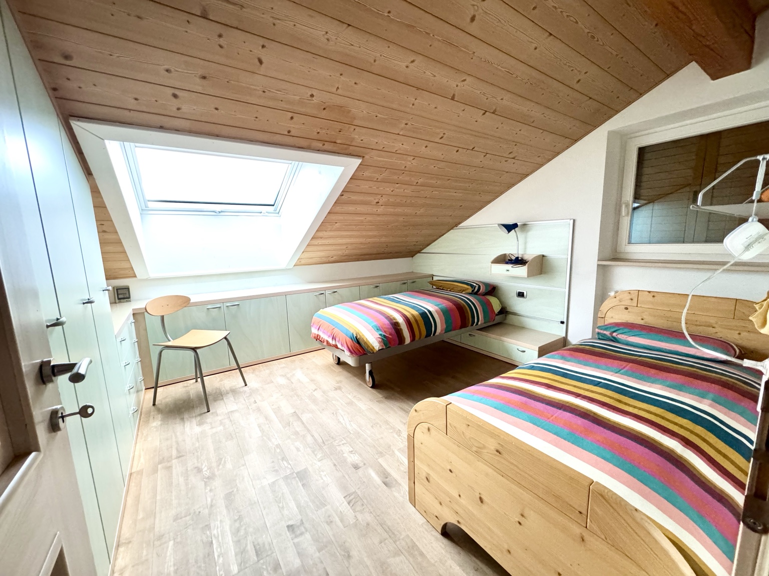 Twin bedroom with exposed timber ceiling
